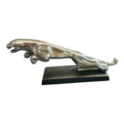 Polished metal Jaguar Cars desk ornament / mascot mounted on rectangular base, 30.5cm in length.