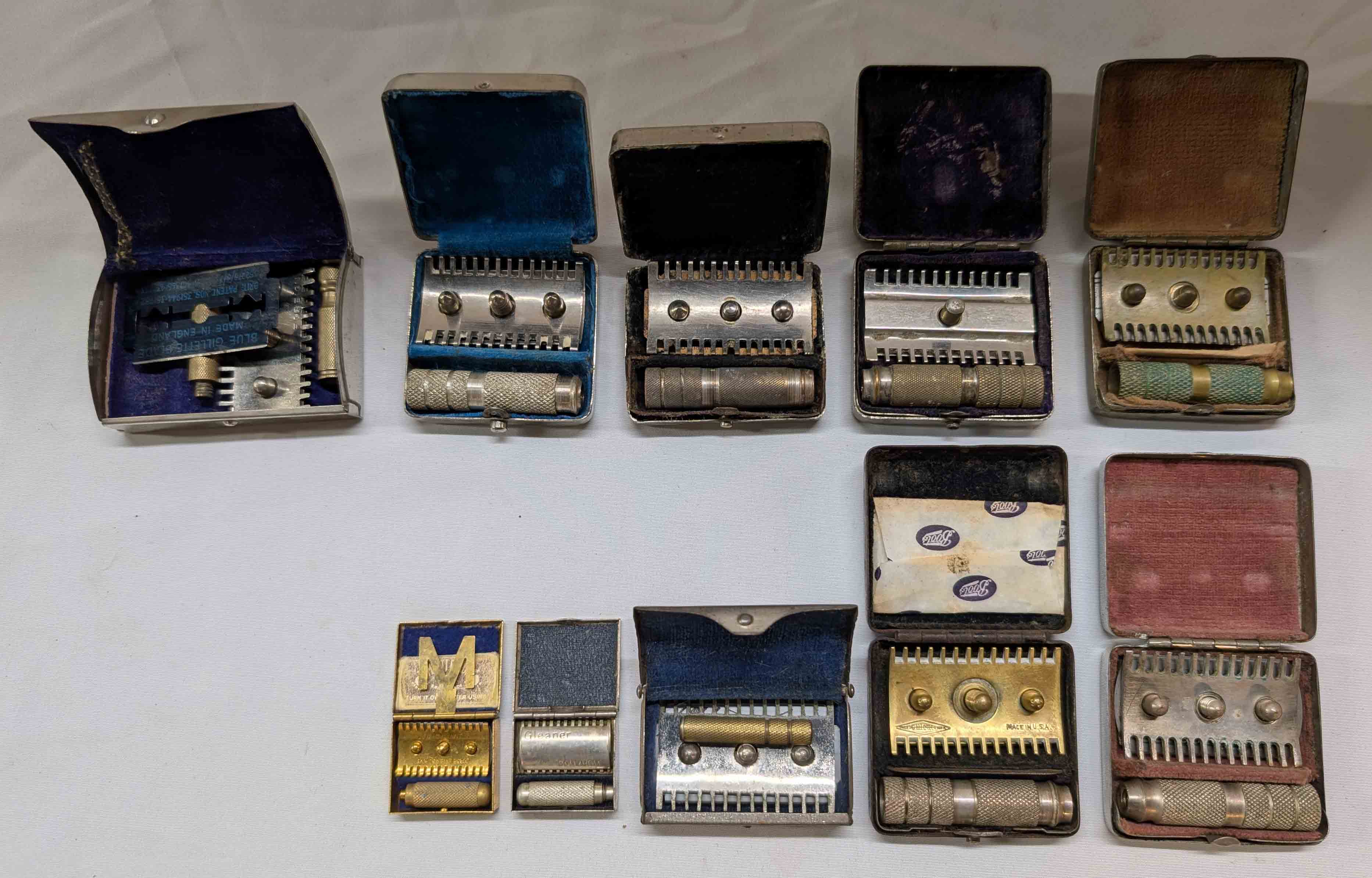 Safety Razor Assortment A quantity of assorted mini folding safety razors in metal cases ...