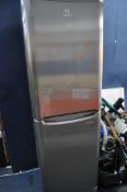 AN INDESIT TALL FRIDGE FREEZER width 60cm, depth 65cm, height 183cm (PAT pass and working) Condition