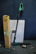 A FERREX CORDLESS HEDGE TRIMMER with one battery and charger (PAT pass and working), a pasting table