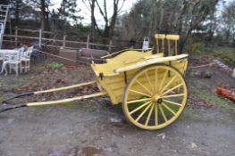A TWO SEAT HORSE DRAWN CART, with leaf spring suspension to rubberised steel on wooden wheels axle