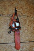 A HUSQVARNA 141 PETROL CHAINSAW with blade guard (engine pulls freely but hasn't been started)