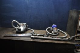 A DYSON DC26 CITY VACUUM CLEANER, a Russell Hobbs vacuum cleaner and a Hoover Enigma vacuum