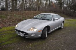A 2004 JAGUAR XK8 TWO DOOR SPORTS COUPE AUTO, in silver with the registration BJ54 XFC, 4196cc V8