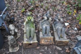 THREE EARLY 20th CENTURY CAST POTTERY GARGOYLES all constructed in two parts with central voids