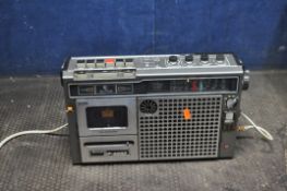 A SHARP GF-6000 VINTAGE PORTABLE HI FI (PAT fail due to uninsulated plug but working) Condition