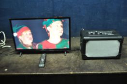 A JVC 24in LED SMART TV with a universal remote and a Silvercrest SBLV20A1 Bluetooth speaker (both