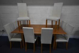A MARKS AND SPENCER HOME LIGHT OAK EXTENDING DINING TABLE, with one additional leaf, extended length