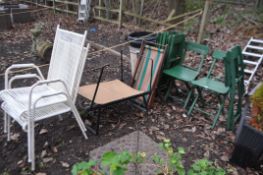 A SET OF SIX GREEN PAINTED WOODEN FOLDING PAVILLION CHAIRS with slatted backs and seats, a child's