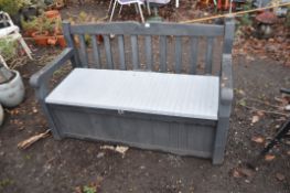 A KETER PLASTIC GARDEN BENCH with storage under seat, width 139cm