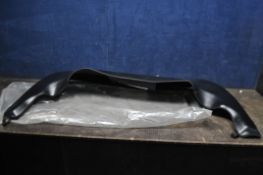 A SPORTS CAR SOFT TOP COVER for retracted roof (unknown make or model)