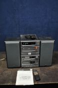 A DENON D-C30 MINI HI FI with remote and matching speakers (PAT pass and working but both tape