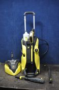A KARCHER K7 PREMIUM FULL CONTROL PLUS PRESSURE WASHER with lance, one nozzle, patio head and
