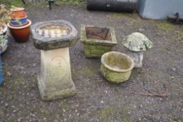 FOUR CONCRETE GARDEN ITEMS including a square sectioned bird bath 65cm high, a mushroom, two
