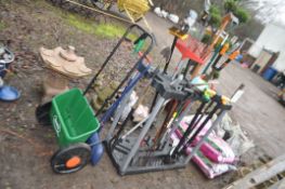 A PLASTIC GARDEN TOOL CADDY CONTAINING GARDEN TOOLS including Wilkinson Sword lawn clipper, tree