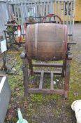 A MELOTTE SEPARATOR VINTAGE BUTTER CHURN with an oak coopered barrel, cast iron base, 120cm high