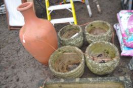 FOUR ROUND CONCRETE PLANTERS AND A PLASTIC URN three of the round planters and matching and a barrel