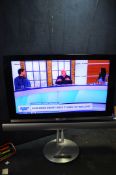 A BANG AND OLUFSEN BEOVISION 7-55 55in TV on rotating stan, remote and soundbar (PAT pass, TV and