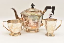 A GEORGE VI THREE PIECE SILVER TEA SET, comprising of a teapot, sugar bowl and milk jug, the
