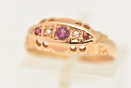 AN EARLY 20TH CENTURY RUBY AND DIAMOND BOAT RING, scrolling pattern, hallmarked 18ct Birmingham