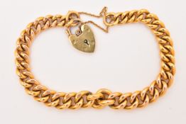 A 9CT YELLOW GOLD CURB LINK BRACLET, fitted with a heart padlock clasp and safety chain,