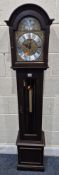 A TEMPUS FUGIT MAHOGANY CASED GRANDDAUGHTER CLOCK, with an arched hood, the glass door enclosing a