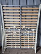 A MODERN WHITE TUBULAR METAL 4FT6 BEDSTEAD, with side rails, slats and bolts, condition report: