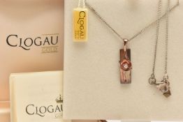 A SILVER 'CLOGAU' ROSE INGOT PENDANT, set with a round brilliant cut diamond, suspended from a