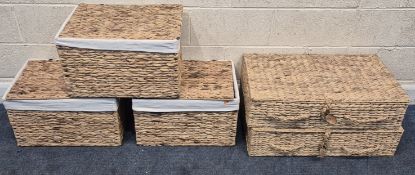 A PAIR AND A SET OF THREE WICKER BASKETS, longest baskets width 76cm x depth 46cm x height 20cm,