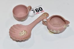 THREE PIECES OF WEDGWOOD JASPERWARE, comprising a pink miniature cream jug and teacup, and a pink