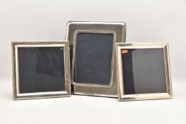 THREE SILVER FRONTED PICTURE FRAMES, two frames measures approximately 250mm x 250mm, one measures