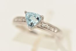 A 9CT WHITE GOLD GEM SET RING, a triangular cut aquamarine, flanked with round brilliant cut