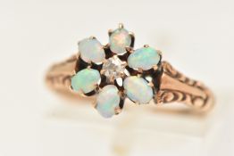 AN EARLY 20TH CENTURY YELLOW METAL OPAL AND DIAMOND FLORAL RING, unmarked, ring size K 1/2,
