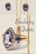 A YELLOW METAL PENDANT AND EARRING SET, oval cut blue purple stones, assessed as quartz, pendant