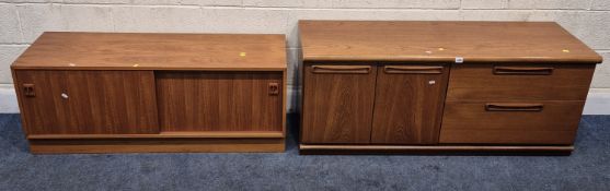 A MID-CENTURY TEAK WALL UNIT BASE, fitted with double cupboard doors and two drawers, width 135cm