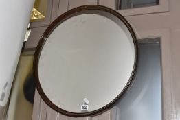 A FRENCH GILAC MID 20TH CENTURY MIRROR with a smoked acrylic frame, pressed manufacturers marks to