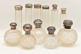 AN ASSORTMENT OF SCENT BOTTLES AND VANITY JARS, to include five cut glass scent bottles fitted