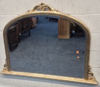 A MODERN GILT RESIN BEVELLED EDGE OVERMANTEL MIRROR, with foliate crest and mounts, width 145cm x