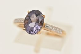 A 9CT YELLOW GOLD GEM SET RING, oval cut purple quartz and single cut diamonds, hallmarked 9ct