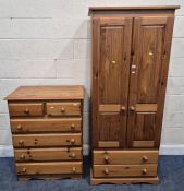 A MODERN PINE DOUBLE DOOR WARDROBE, with two drawers, width 74cm x depth 52cm x height 178cm,