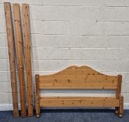 A MODERN PINE 5FT BEDSTEAD, with siderails and central support, condition report: missing slats,
