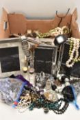 A BOX OF ASSORTED ITEMS, to include a quantity of costume jewellery, two photo frames, napkin rings,