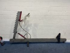 A VINTAGE AUTOMOTIVE FRAME PULLER, with hydraulic operation (leaking) 305cm long 170cm high