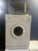 A CREDA REVERSAIR TUMBLE DRYER, width 60cm, depth 57cm, height 85cm, along with a Russell Hobbs