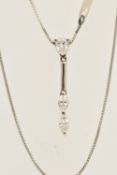 A 14CT WHITE GOLD DIAMOND PENDANT, a pear cut diamond and two marquise cut diamond in a drop