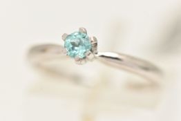 A 9CT WHITE GOLD GEM SET RING, set with a circular cut light blue stone, hallmarked 9ct