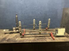 A DUNLOP OPTICAL ALIGNMENT GAUGE WHEEL ALIGNMENT FRAME SET, with clear optics but one damaged clip