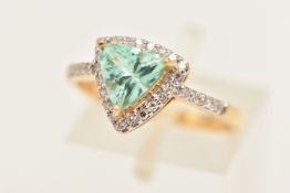 AN 18CT YELLOW GOLD GEM SET RING, a triangular cut blue green stone assessed as tourmaline, set with