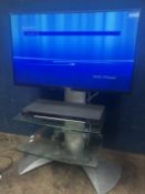 A SONY BRAVIA 32'' LCD TV, PAT pass and working, no remote, stand but attached to glass tv stand,