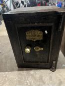 A VINTAGE CYRUS PRICE & CO, WOLVERHAMPTON, FIRE SAFE with two door keys, three internal drawers